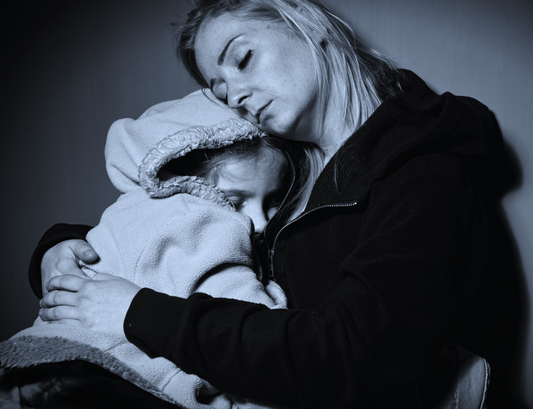 mother and daughter keeping warm