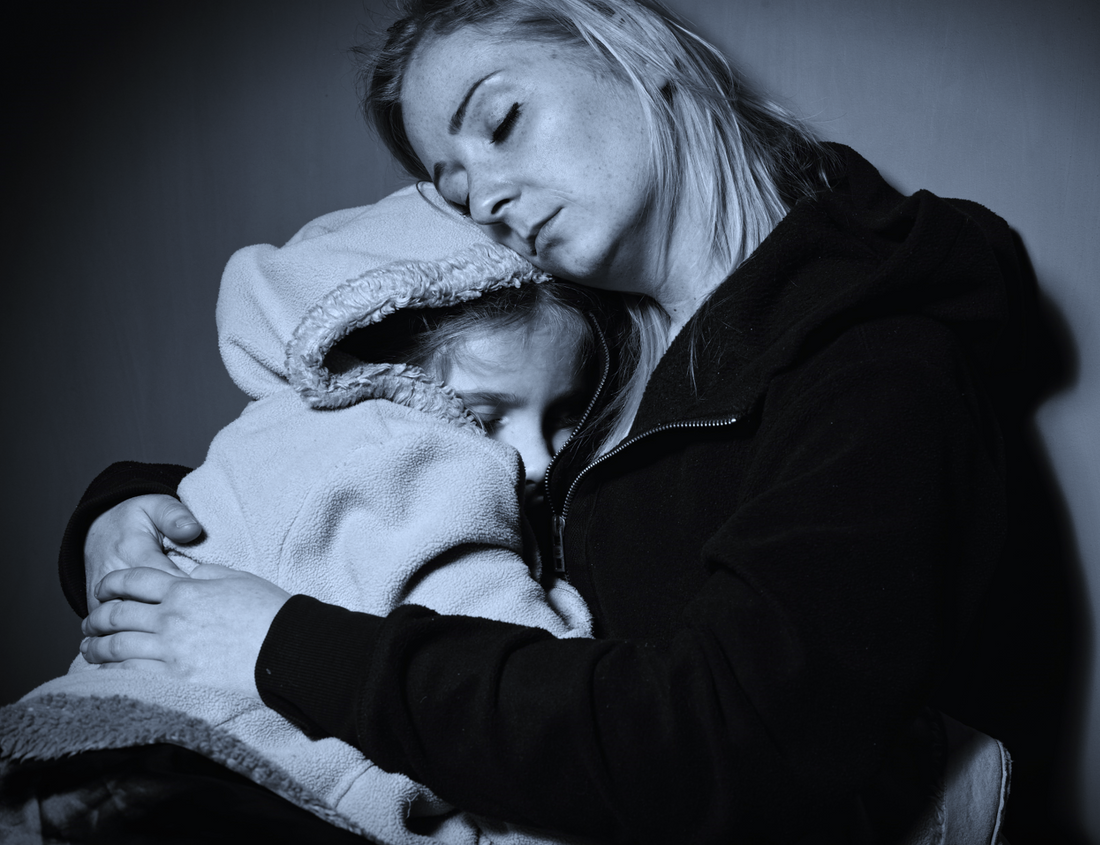 mother and daughter keeping warm